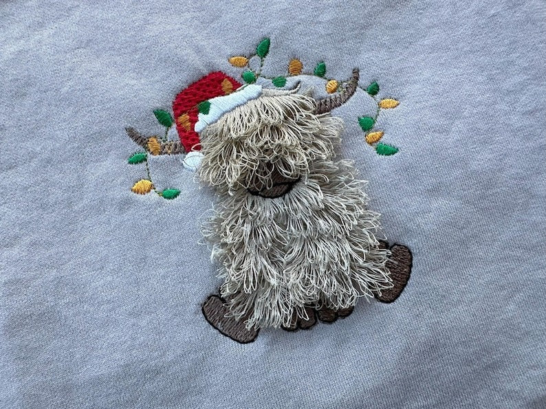 Highland Cow Christmas Santa hat Christmas Fluffy Embroidered Sweatshirt, Fringe Embroidered Sweatshirt, Embroidered Sweatshirt